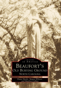 Sepia-toned photo of a statue in a cemetery, surrounded by trees. Text: Beaufort’s Old Burying Ground.