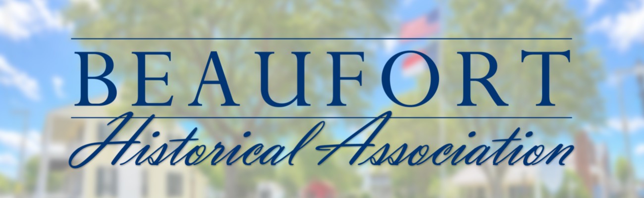 Text reads “BEAUFORT Historical Association” over a blurred outdoor background with trees and sky.