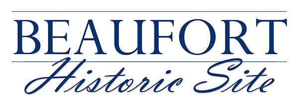 Sign reading “Beaufort Historic Site” in blue text on a white background.